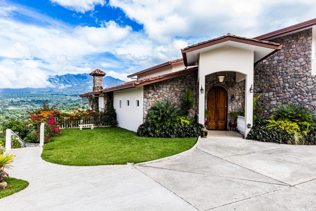 green grass field and brown wooden door