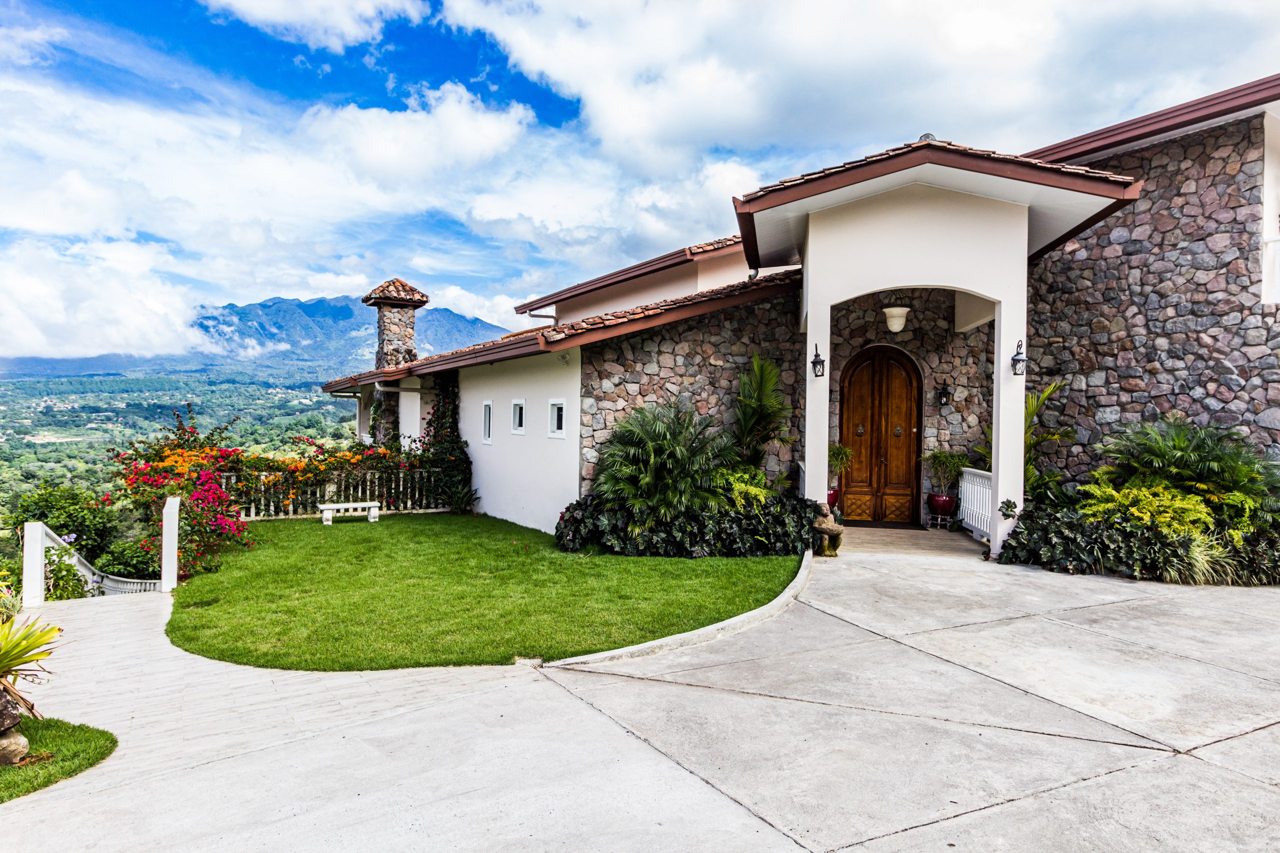 green grass field and brown wooden door